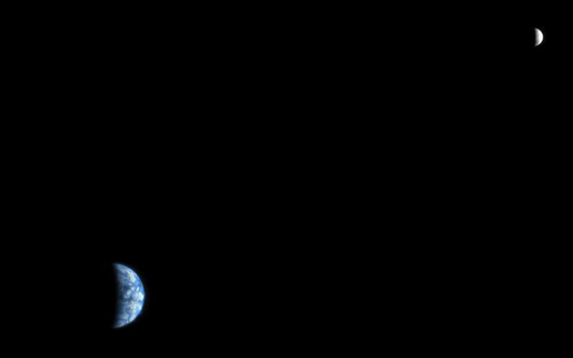 The High Resolution Imaging Science Experiment (HiRISE) camera would make a great backyard telescope for viewing Mars, and we can also use it at Mars to view other planets. This is an image of Earth and the moon, acquired on October 3, 2007, by the HiRISE camera on NASA's Mars Reconnaissance Orbiter.
