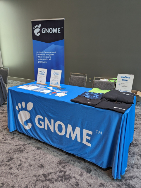 Photo of GNOME table at FOSSY 