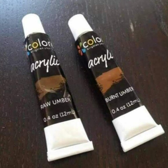 Two tubes of acrylic paint, one labelled "Raw umber" the other "burnt umber"