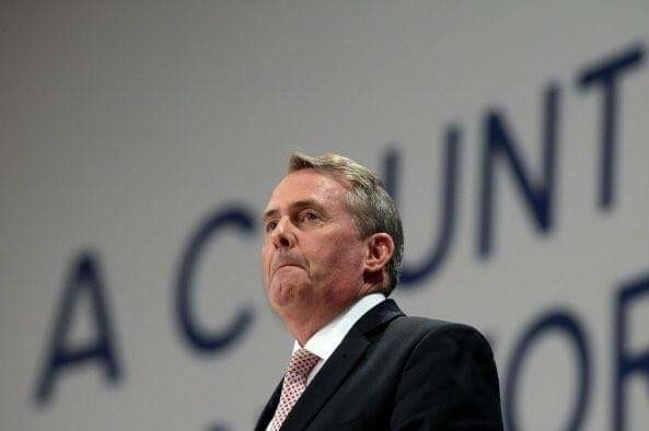 Some other tory in front of the same backdrop. It probably says country, but his head is in front of a letter so it says "a cunt" behind him