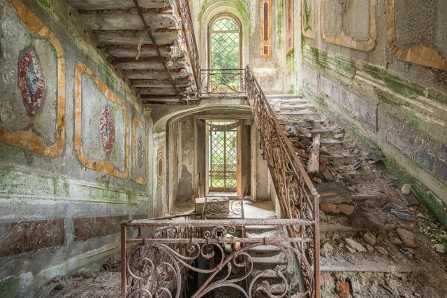 crumbling stairs in an abandoned villa