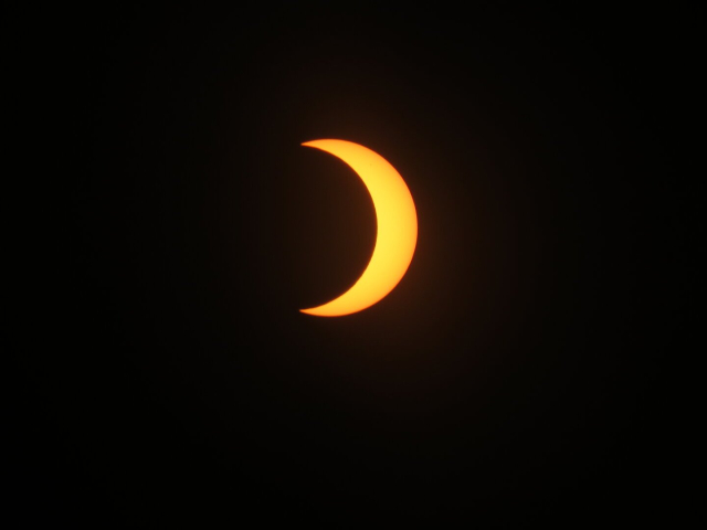 A bright yellow orange crescent.