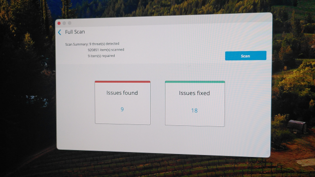 A McAfee virus scan on an Apple iMac completed with 9 issues found and 18 issues fixed