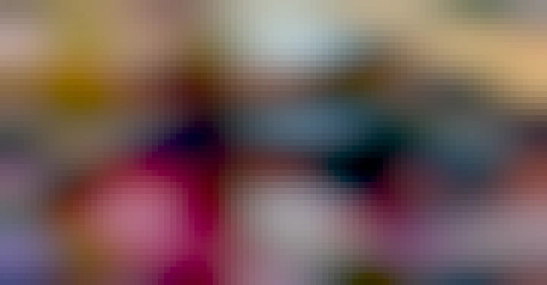 a screenshot from a youtube video; five 3.5 inch hard drives are attached through a spaghetti mess of cables to an upside down laptop