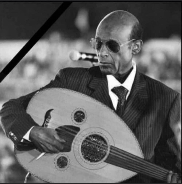 Muhammad El Amin playing the oud and singing