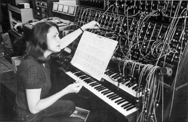 Wendy Carlos working the patchbay on a classic synth bank