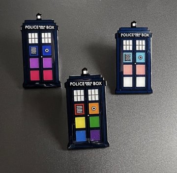 Tiny tardis pins in trans and lgbtq+ colors