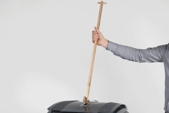 The stembusstamper is a longish piece of wood that fits through the slot meant for ballots. It allows one to tamp down wayward ballots so there is more room in the ballot box.