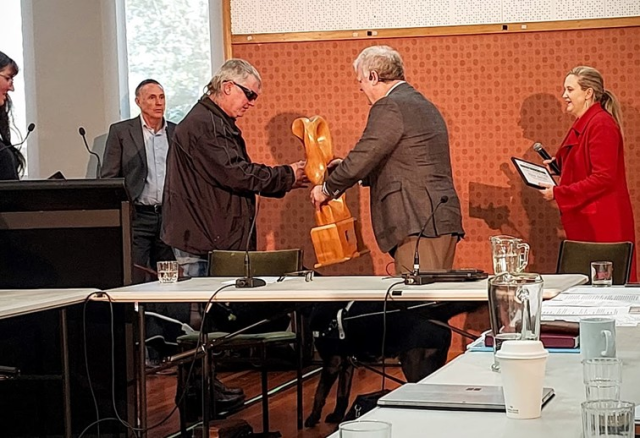 Gene Gibson receiving his Chair’s Award from Clive Lansink. The award is a beautiful wooden carving. Acting CE of Blind Low Vision NZ, Greg Hurn, and Board Secretary, Diana Chandler, look on.