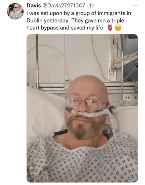 A picture of a man in hospital, sitting up, with the caption "I was set upon by a group of immigrants in Dublin yesterday. They gave me a triple heart bypass and saved my life."