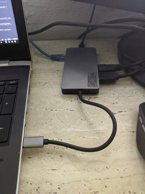 Laptop with a single connected usb-c cable to feed power, lan and two monitors...
