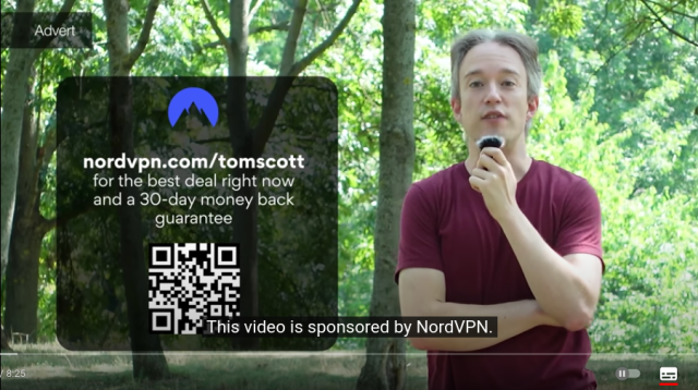 A screenshot of YouTube video featuring Tom Scott and a QR code that is missing quiet zone around it.
