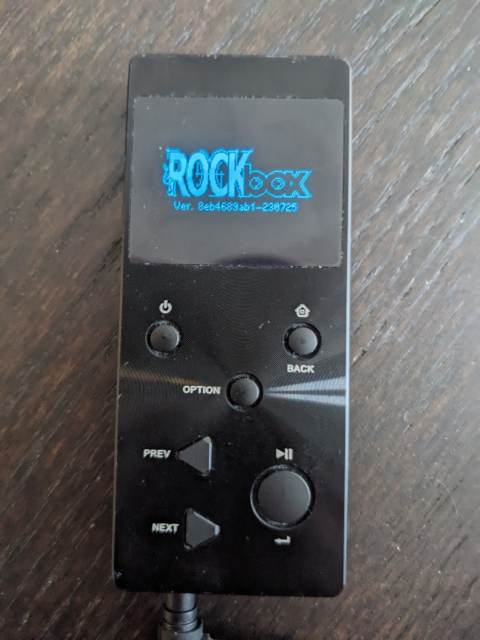 Photo of an mp3 player displaying the rockbox logo