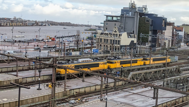 A train of three NS Series 1700 locomotives leaving station Amsterdam Centraal 