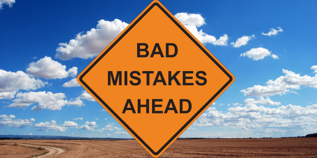 a road sign saying "bad mistakes ahead"
