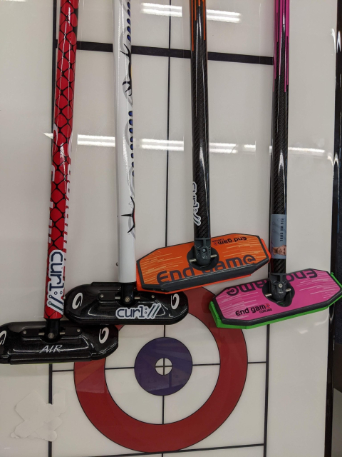 4 curl brooms with curl stickers
