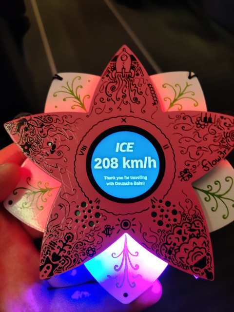 The "Flow3r" Badge from Chaos Communication Camp 2023 showing the speed of our ICE Train at 208 km/h