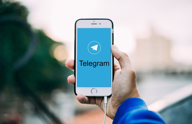 Phone with the Telegram app on screen