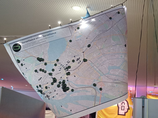 A printed map of Hamburg with surveillance cameras