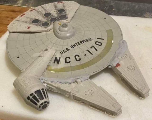 A model of the Millennium Falcon from Star Wars with the markings of the USS Enterprise from Star Trek
