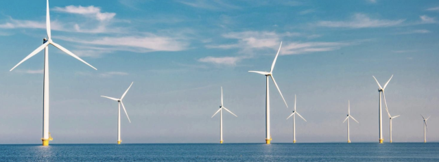 wind turbines standing in water