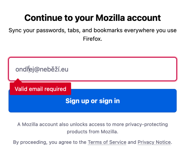 A screenshot of a web page titled "Continue to your Mozilla account" asking for e-mail address, producing error "Valid email required" when the e-mail address is "ondřej@neběží.eu".