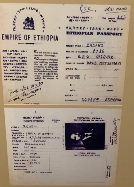 Mandela's Ethiopian passport.

Top left reads "Empire of Ethiopia" along with insignia of the Ethiopian monarchy of the era. 

Underneath it reads in Amharic and in English: "To all whom it may concern. Greetings. We request the civil and military authorities of all friendly countries to allow the bearer to pass freely and without hindrance and to afford him every assistance of which he stands in need."

Signature of Zewde Hailemariam, an Ethiopian government official at the time.

Passport number: 8786.
Name: David Motsamayi. 
Nationality: Ethiopian.

The lower page:

Profession: journalist.
Birth: 18/7/1918, Bechuanaland (defunct British protectorate, now South Africa)
Height: 1.78
Eye color: Brown
Hair color: Black