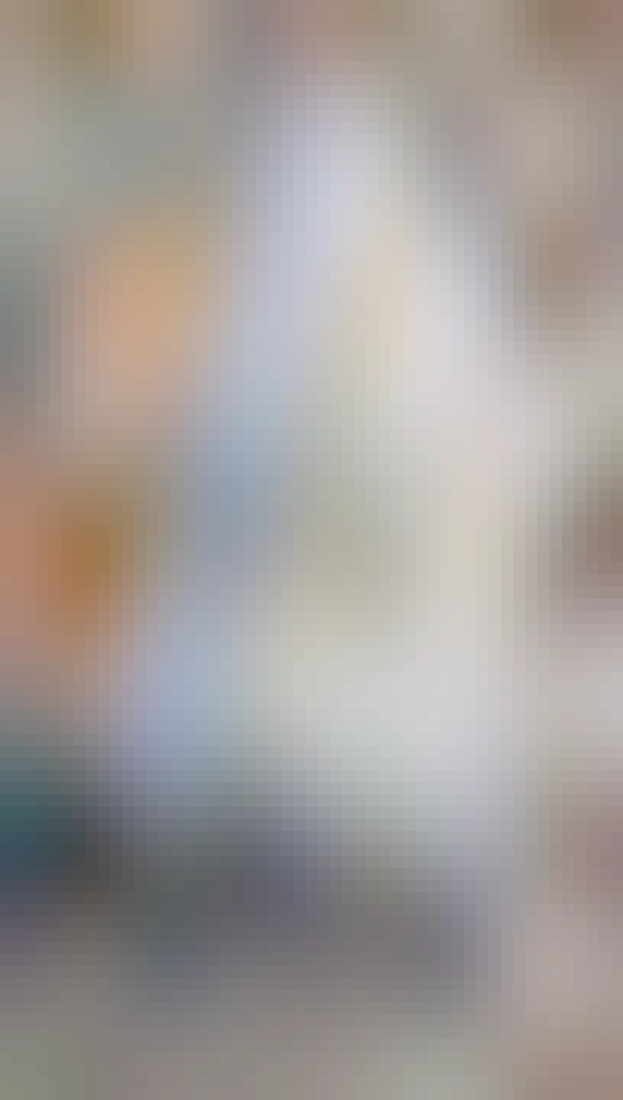 A blue book with brass grommets in the covers, laced around the spine like a corset 