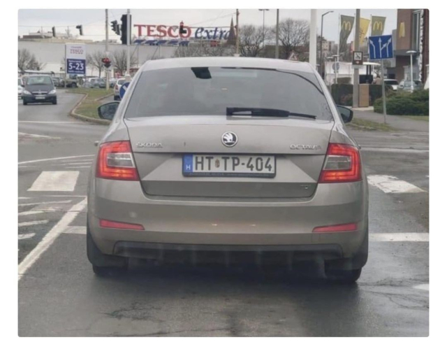 Car with a HT-TP-404 License Plate.