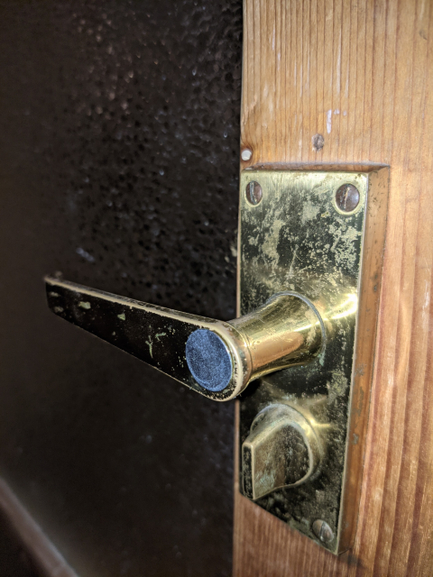 Small steel plate glued to the door handle 