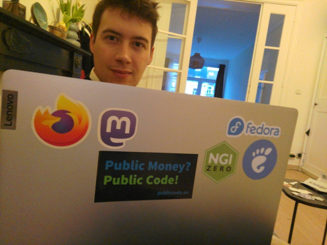 A laptop with Firefox, mastodon, fedora, gnome, NGI Zero and Public Money Public code stickers