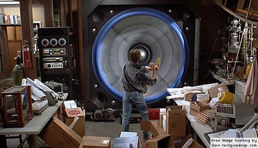 A scene from Back To The Future, where Marty McFly plays a guitar chord while plugged into a massive speaker. 