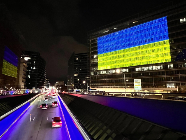 The Ukranian flag projected on the European Commission headquarters Berlaymont two years after the start of Russia's full-scale invasion of Ukraine.