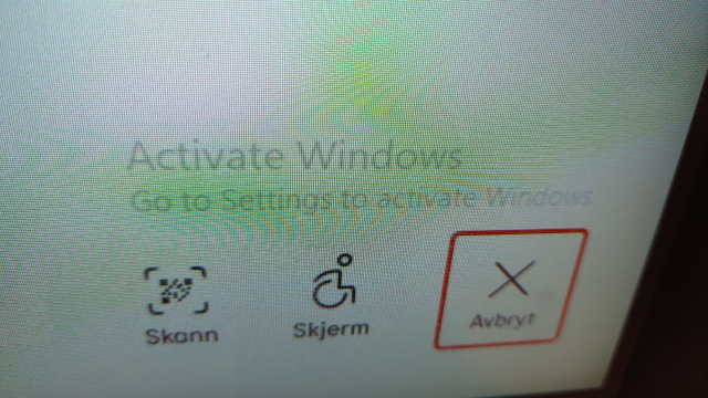 Closeup of the "Activate Windows. Go to Settings to activate Windows." text; it's a barely legible light grey on a white background.