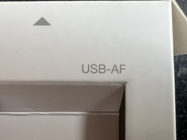 Text printed on part of a box. It reads “USB-AF”.