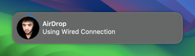 Screenshot of an AirDrop notification on macOS with the message “Using Wired Connection”
