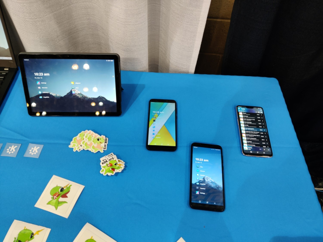 Mobile devices (3 phones and a tablet) running Plasma Mobile at KDE's booth at SCaLE20x.