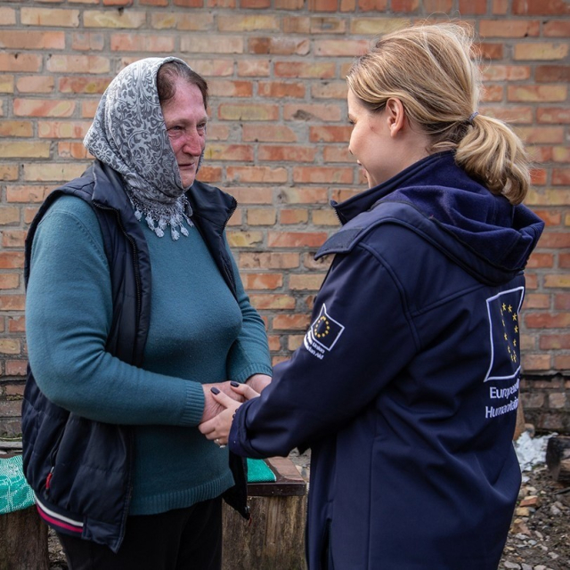 A photo of a person from EU humanitarian aid with a Ukrainian woman named Oksana