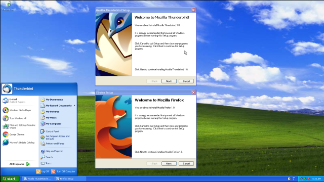 A computer desktop displaying the installation setup windows for Mozilla Thunderbird and Mozilla Firefox on a Windows XP operating system with the classic Bliss wallpaper background. 