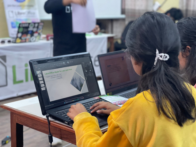 Young lady at Nepalese LibreOffice event, using Impress