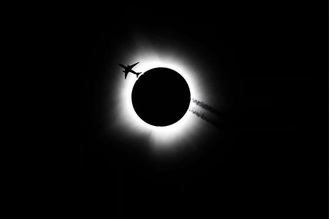 Jet passing in front of the April 8 solar eclipse. Photo by Bobby Goddin