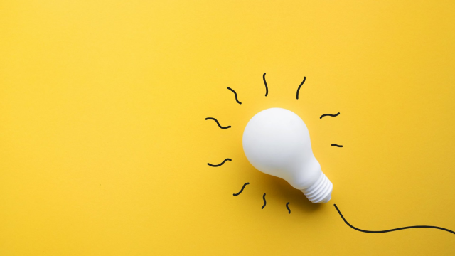 An image with a yellow background and white lightbulb to represent someone having an idea.