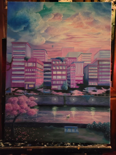 A painting of a city in pink and blue twilight lighting. There's fluffy clouds in the sky and a river and park in the forground