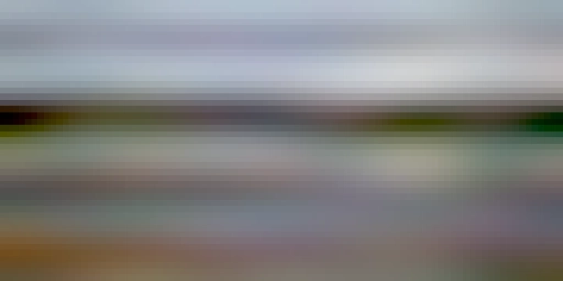 Shown are two rows of casks inside a fenced area.