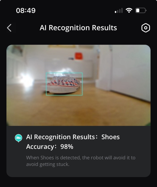 Screenshot of an AI recognition interface showing a pair of shoes on the floor with a 98% accuracy detection, suggesting the AI will navigate around the obstacle.