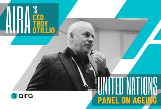 Upper left text reads,  "Aira’s CEO Troy Otillio,” lower right text reads “United Nations Panel On Aging.” Centered, a B&W photo of Troy speaking into a microphone 
