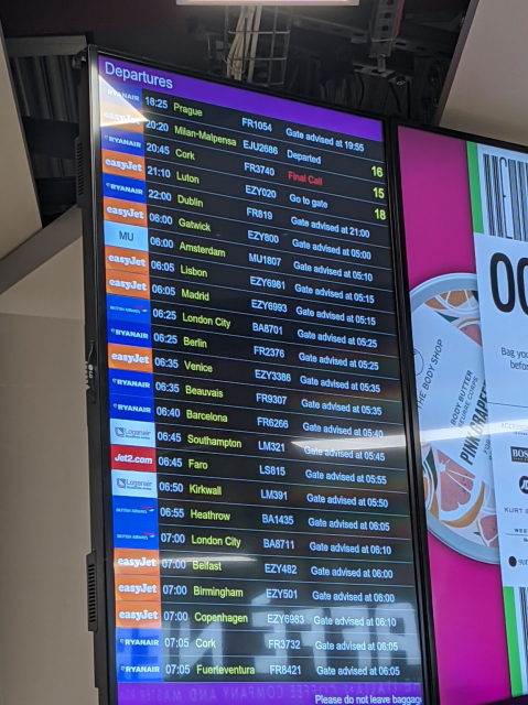 Airport departures table saying "Prague - Gate advised at 19:55"