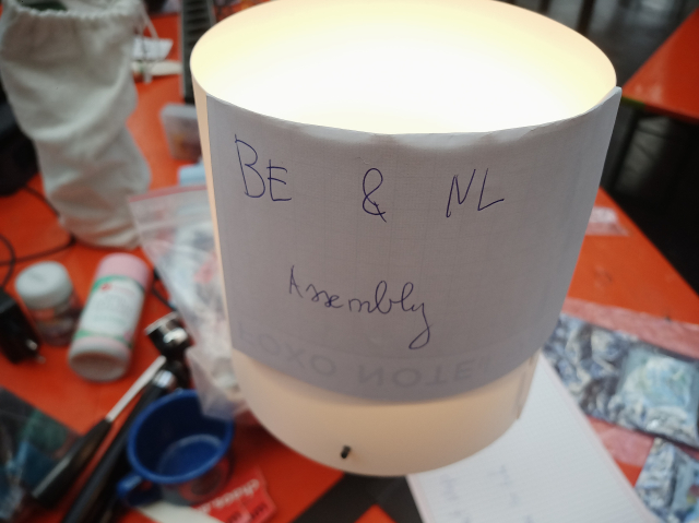 A lamp with a written note 'Be & Nl assembly'