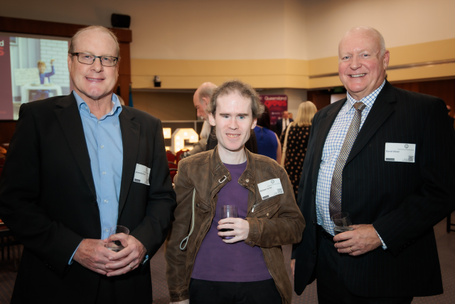 James and Mick from NV Access with David Oliver from Speld, smiling at the camera at the launch of Philanthropy Week 2024.  Photo courtesy Queensland Gives.