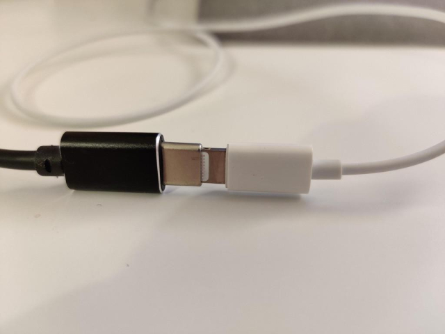 usb-c with lightning adapter plugged into it